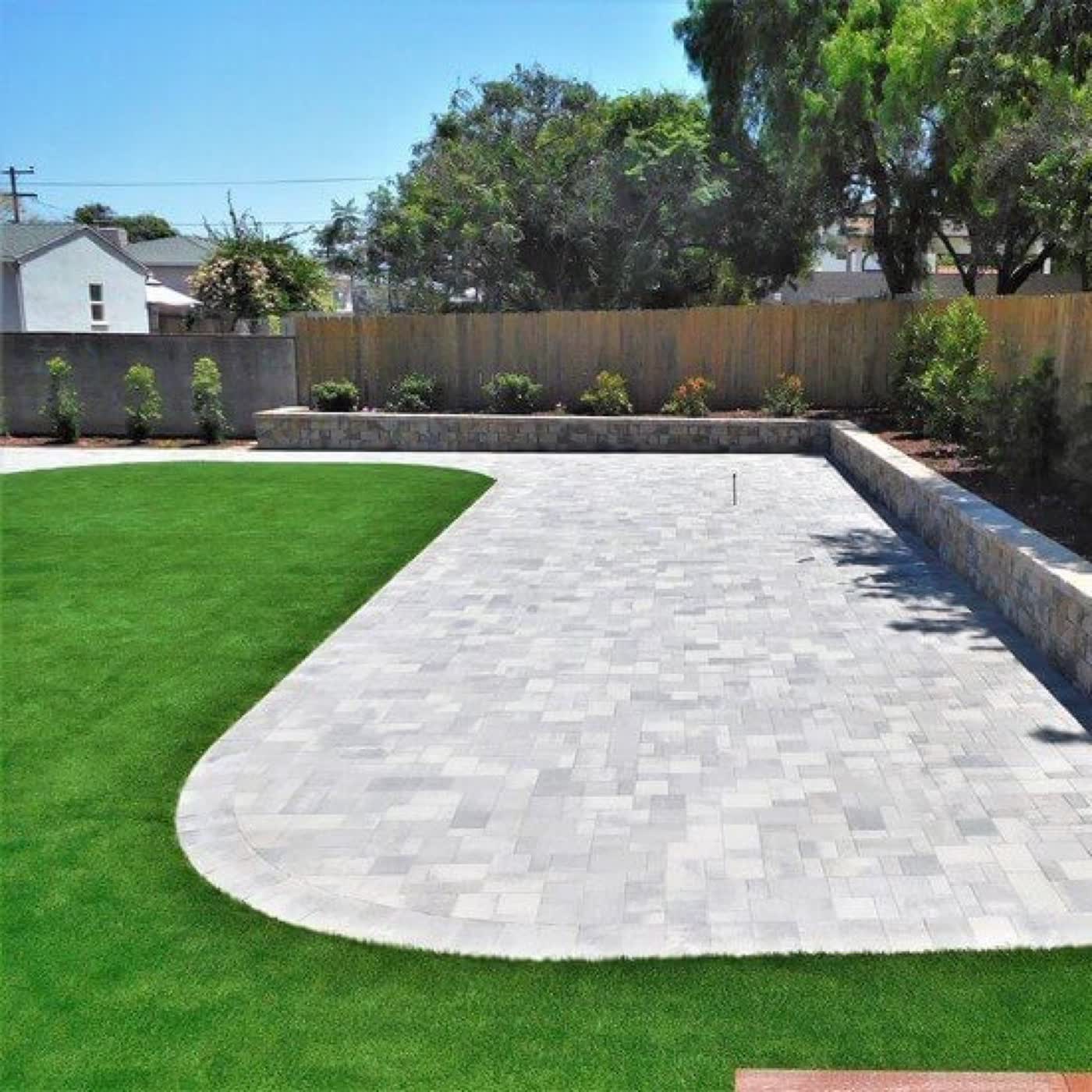 Paver and turf installation in progress by Groundworks