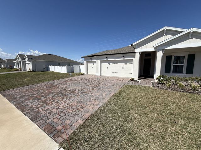 Paver surface cleaned and sealed by Groundworks, Brevard County